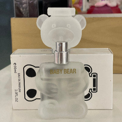 Frosted bear-shaped perfume bottle with 'Baby Bear' text on a white surface.