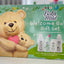 Babi Mild welcome baby gift set packaging with teddy bears and bottles on a green background