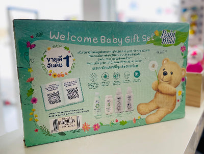 Welcome Baby Gift Set packaging with teddy bear illustration on a blurred background