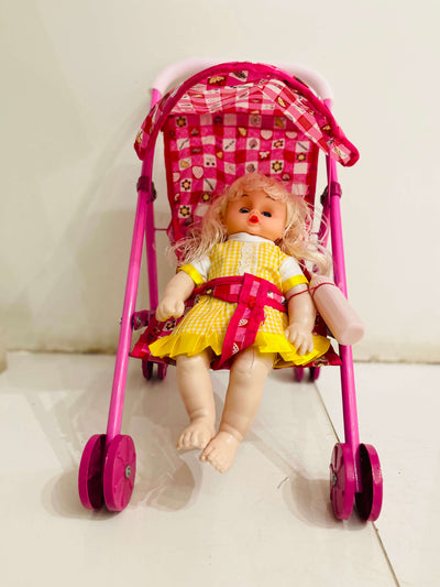 Doll in a pink stroller with a checkered canopy on a light background