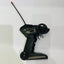 Black remote control with antenna on a white background