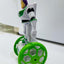 Toy figure on a hoverboard with green wheels against a white background