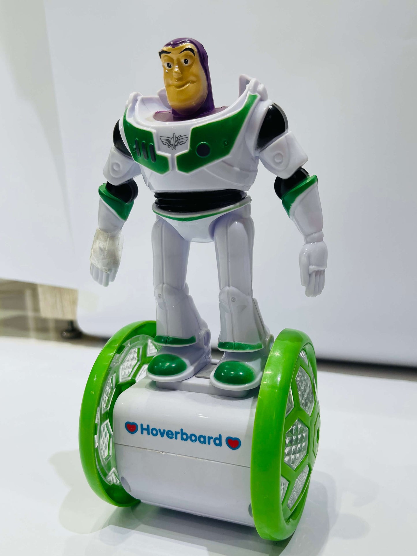 Toy figure on a hoverboard with a white background