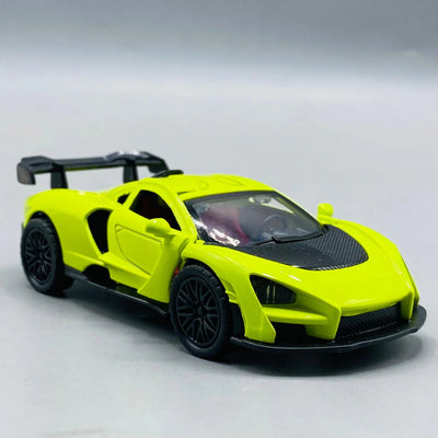 Yellow die-cast sports car model on a gray background