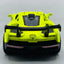 Yellow toy car with black accents on a light gray background