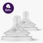 Two baby bottle nipples with a '6m+' label on a white background
