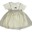 Children's dress with floral pattern and smocked waist on a white background