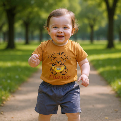 Child wearing a 'Say Hello Fashion Boy' t-shirt.