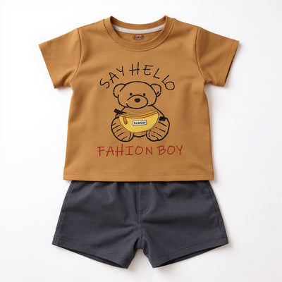 Children's outfit with brown t-shirt and navy shorts featuring a bear graphic and text.
