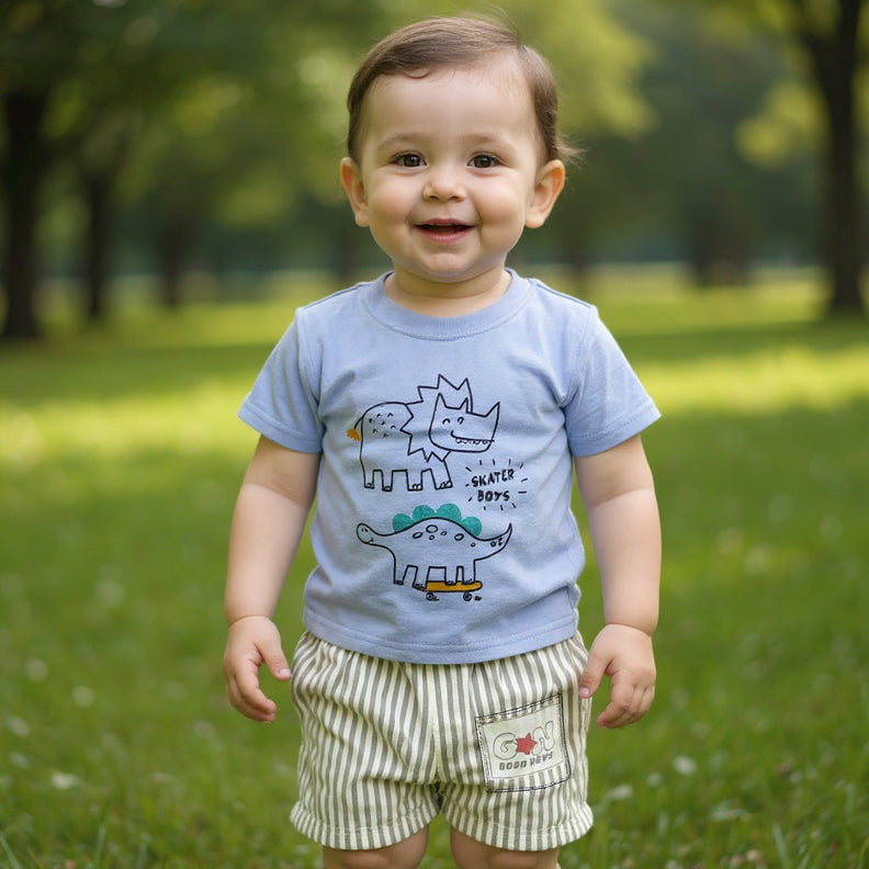 Child wearing a light blue t-shirt with dinosaur designs and striped shorts.