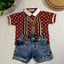 Children's outfit with red patterned shirt, denim shorts.