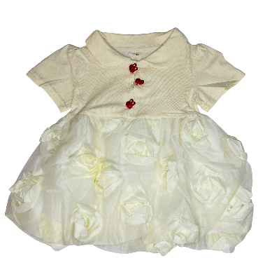 White baby dress with floral details and red buttons on a white background