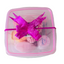 Pink dragon toy in a clear container with pink trim on a white background
