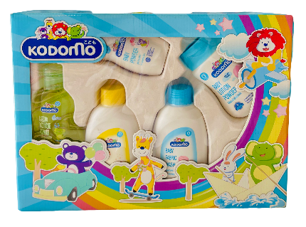 Kodomo baby product set packaging with colorful design and various bottles.