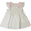 White dress with pink trim and floral pattern on a white background