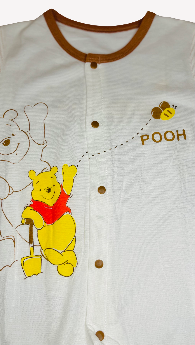 Baby romper with Winnie the Pooh design on a white background