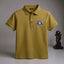 Green polo shirt with a logo on a gray.