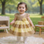 Gold and yellow dress with a floral embellishment 