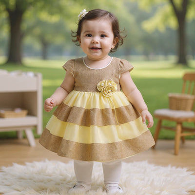 Gold and yellow dress with a floral embellishment 