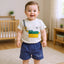 Child wearing a t-shirt with a graphic design.